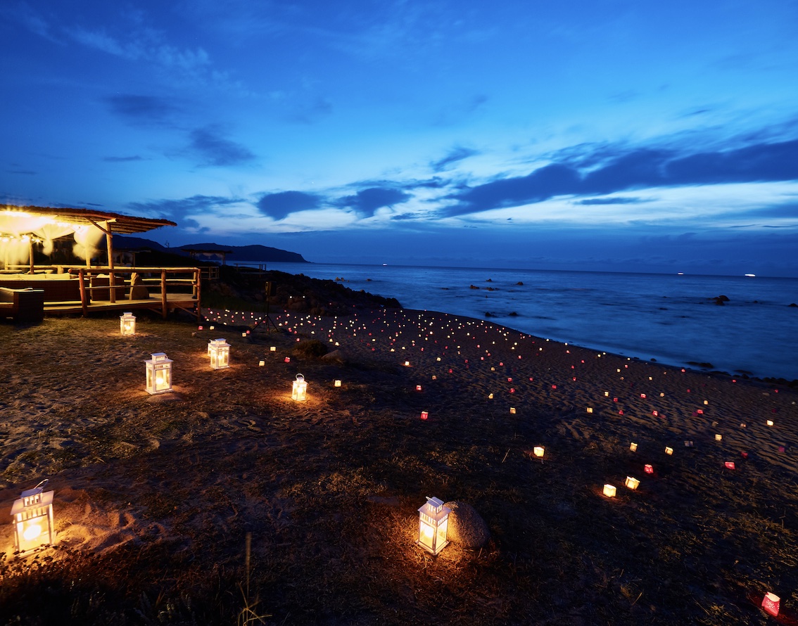 A beach set up for an evening event